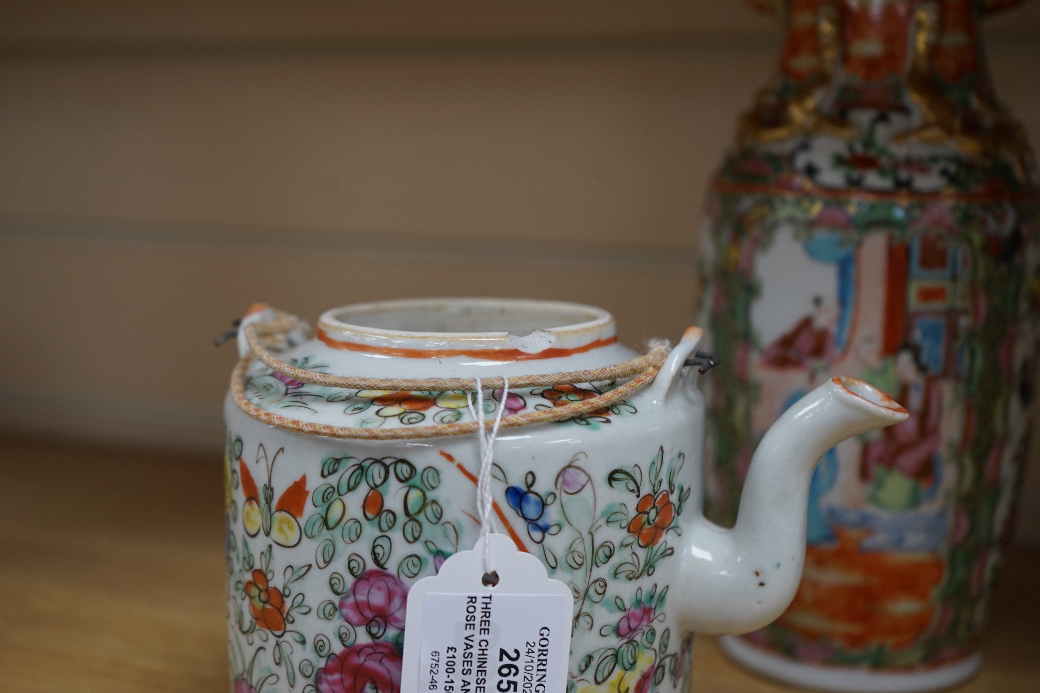 Three Chinese famille rose vases and a teapot, late 19th/early 20th century, tallest vase 29.5 cms high